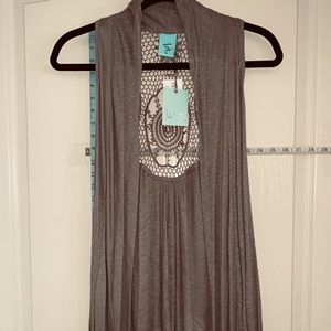 Knit vest with crochet design on back